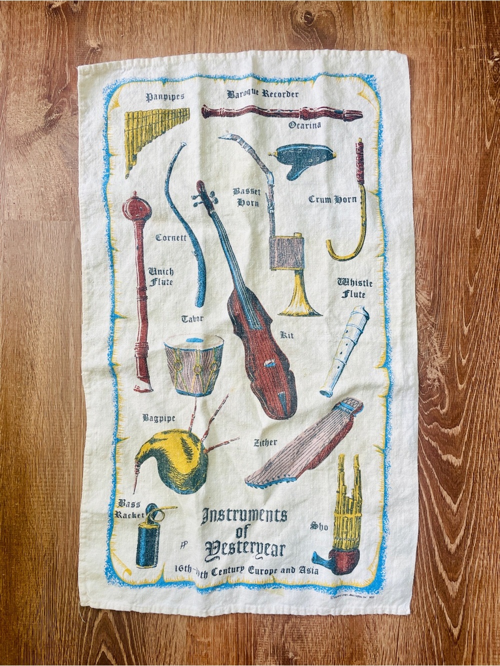 Instruments of Yesteryear Illustrated Tea Towel - Cream with Blue, Yellow, Red